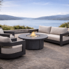 Valmont outdoor aluminum seating collection with fire pit overlooking waterfront view